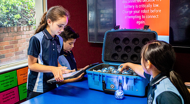 St Bernadette's Catholic Primary Castle Hill students playing with robots