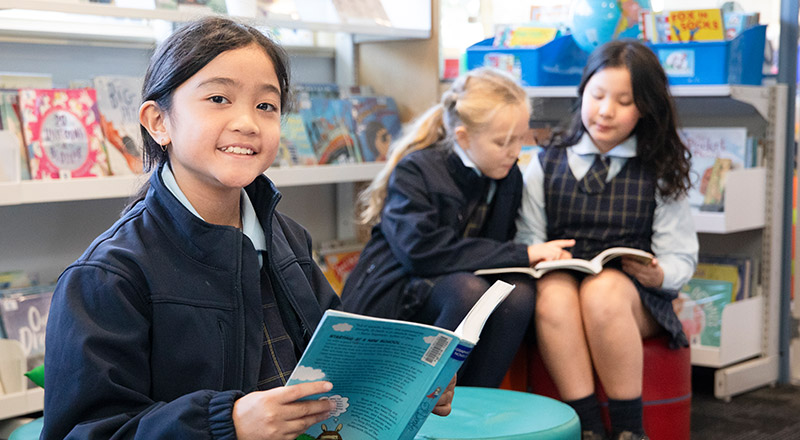 St Bernadette's Catholic Primary Castle Hill students reading in library