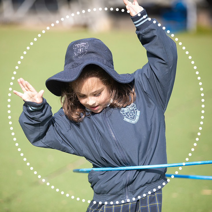 St Bernadette's Catholic Primary Castle Hill girl playing with hula hoop